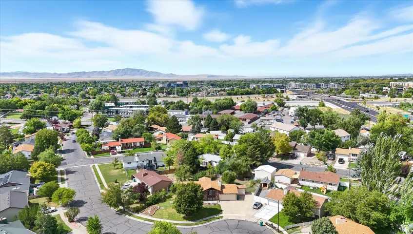 Aerial perspective of suburban area featuring a mountainous background