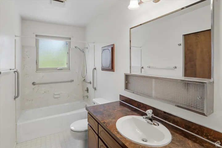 Full bathroom featuring shower / bath combination and vanity