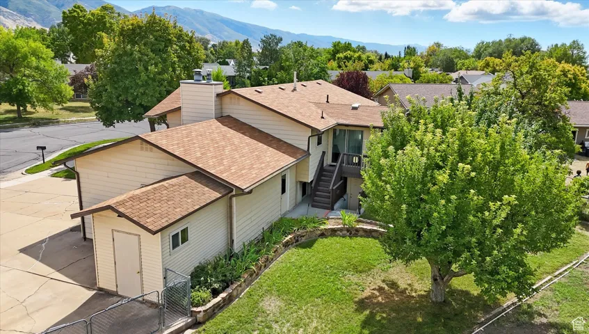Aerial view of residential area featuring a mountain backdrop