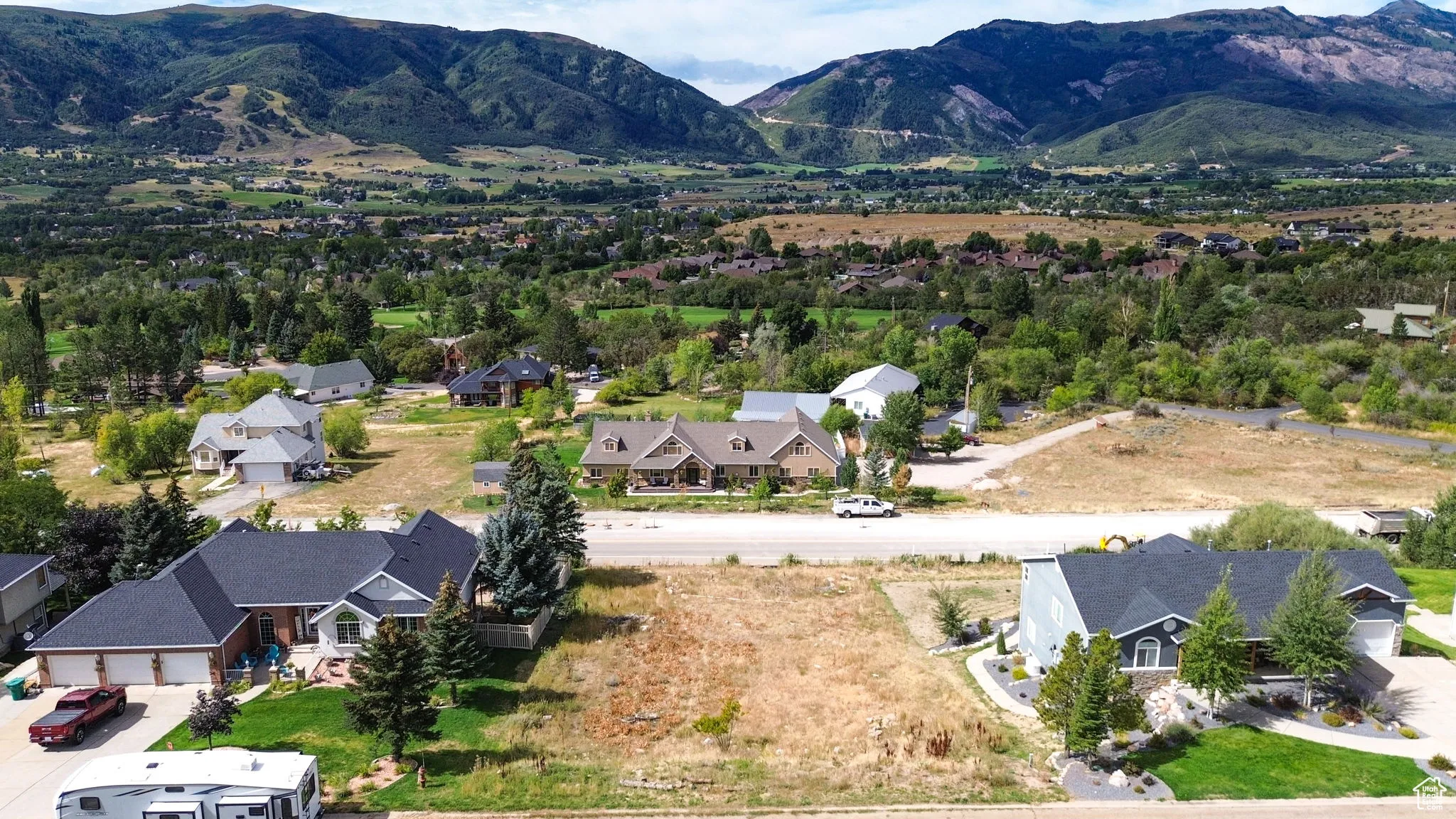 Aerial view of residential area with a mountainous background