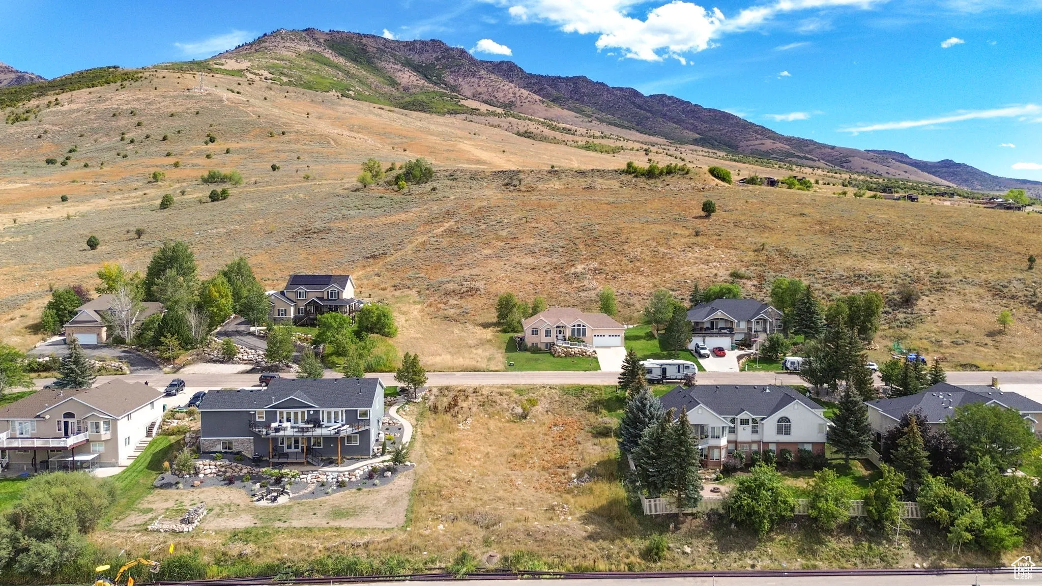 Aerial perspective of suburban area featuring a mountainous background