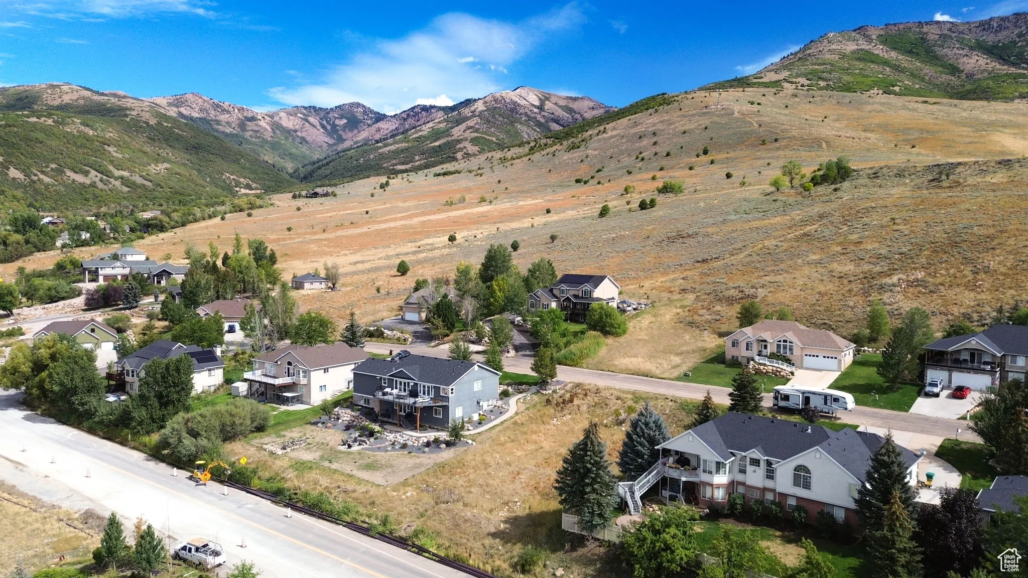 Aerial perspective of suburban area with a mountain backdrop