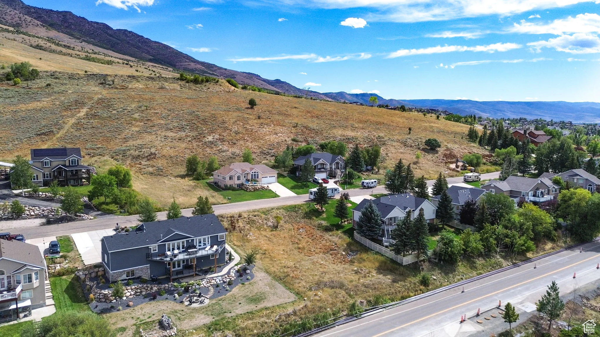 Aerial view of residential area featuring a mountain backdrop