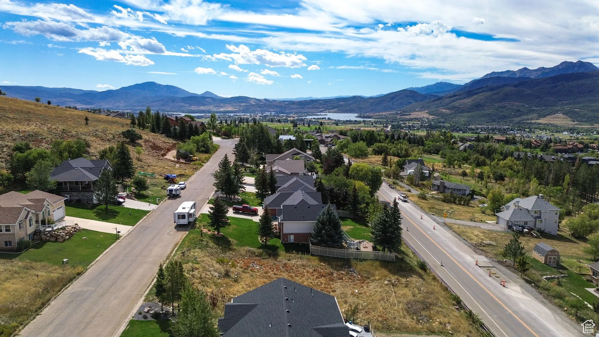 Aerial perspective of suburban area with a mountainous background