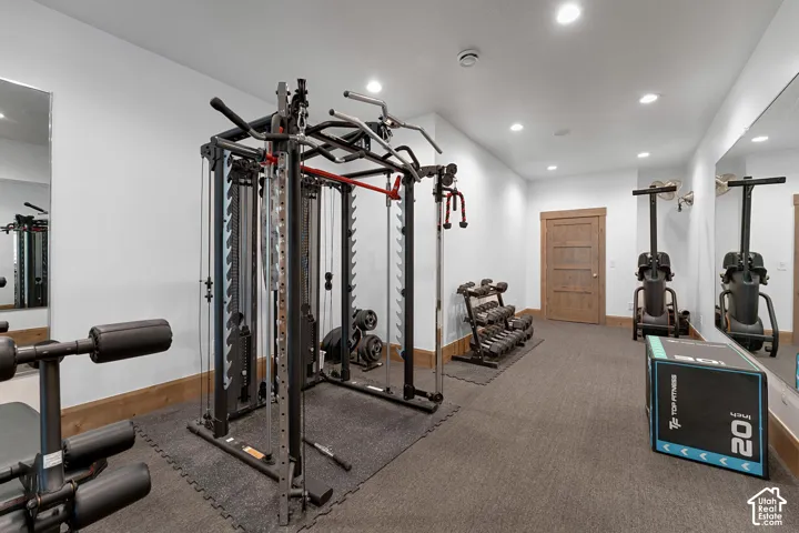 Exercise area featuring recessed lighting and baseboards