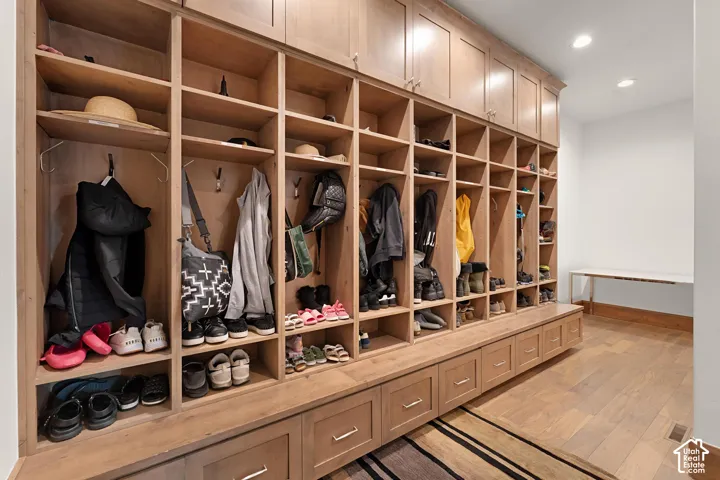Mudroom featuring light wood-style flooring and recessed lighting