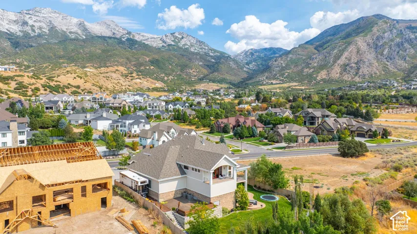 Aerial perspective of suburban area featuring a mountainous background