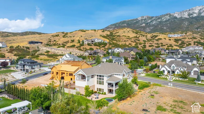Aerial view of residential area featuring a mountain backdrop