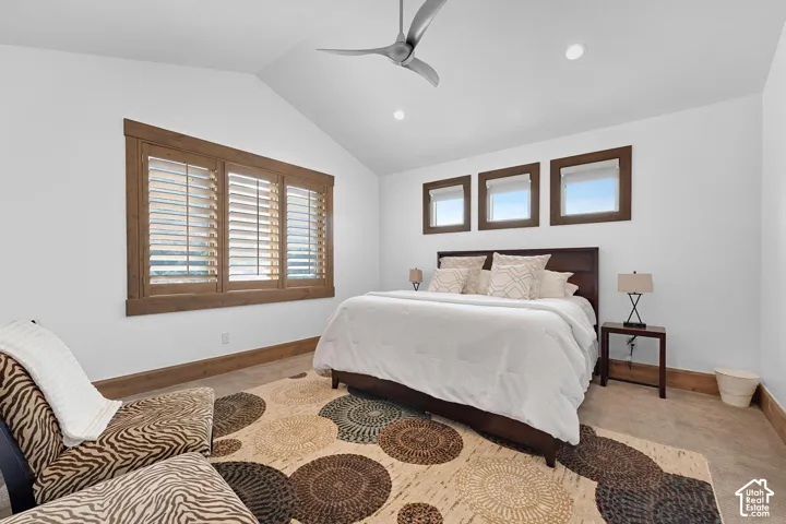 Bedroom featuring lofted ceiling, ceiling fan, recessed lighting, and carpet floors