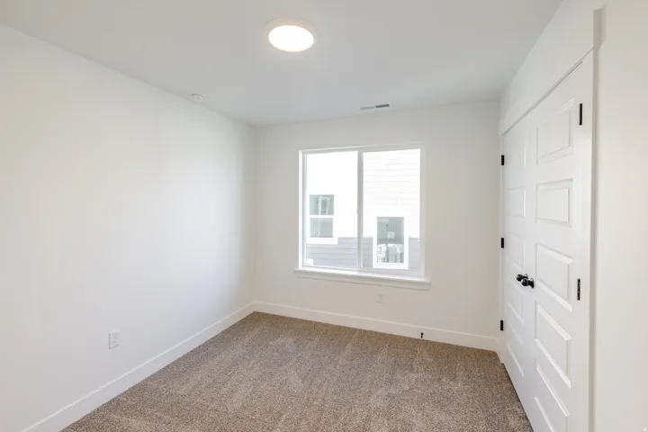 Spare room with carpet flooring and baseboards