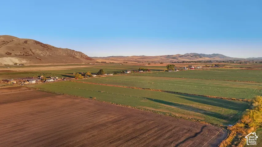 View of mountain backdrop with rural landscape and large plots for crops