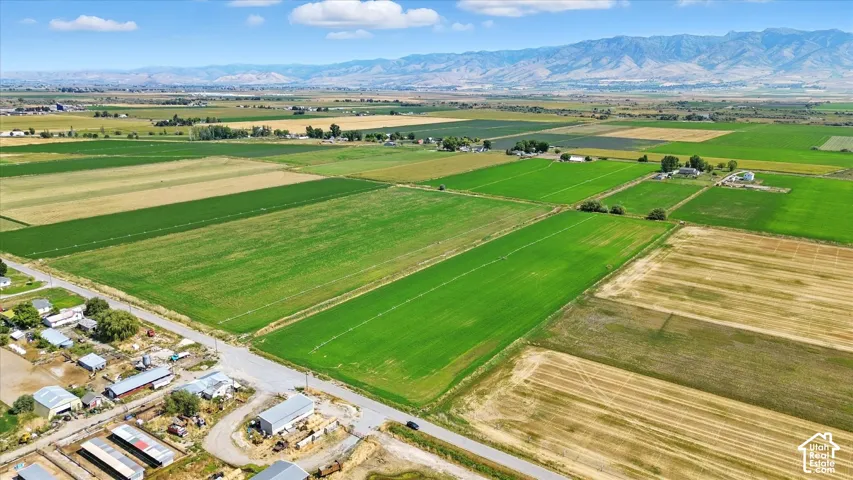 View of rural area featuring abundant farmland and a mountainous background