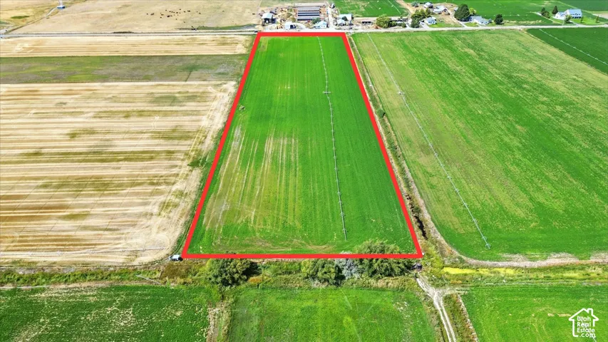 Aerial view of sparsely populated area featuring property parcel outlined