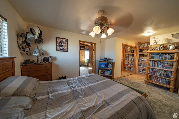 Bedroom featuring carpet flooring and a ceiling fan