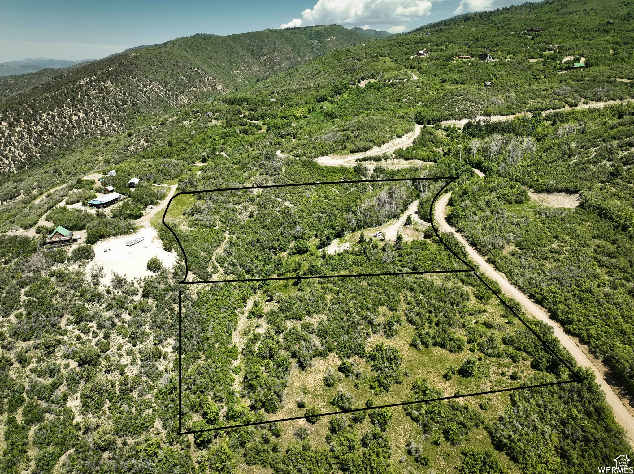 Lot 1 with driveway/pad above, lot 2 open land below