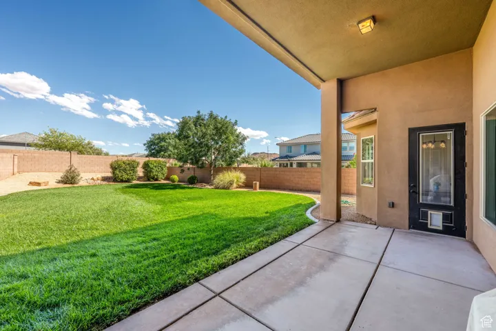 Fenced backyard featuring a patio area