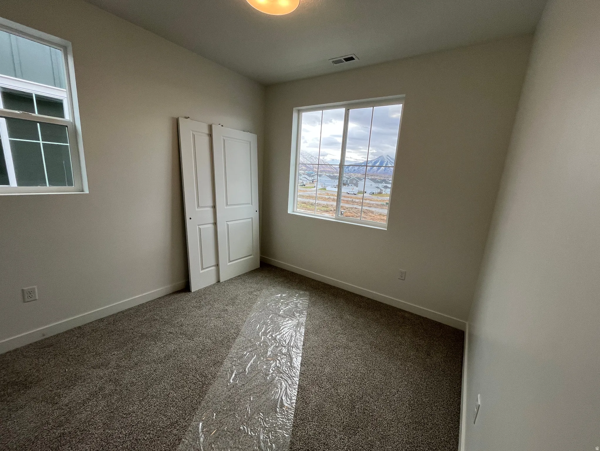 Unfurnished bedroom featuring carpet floors and a closet