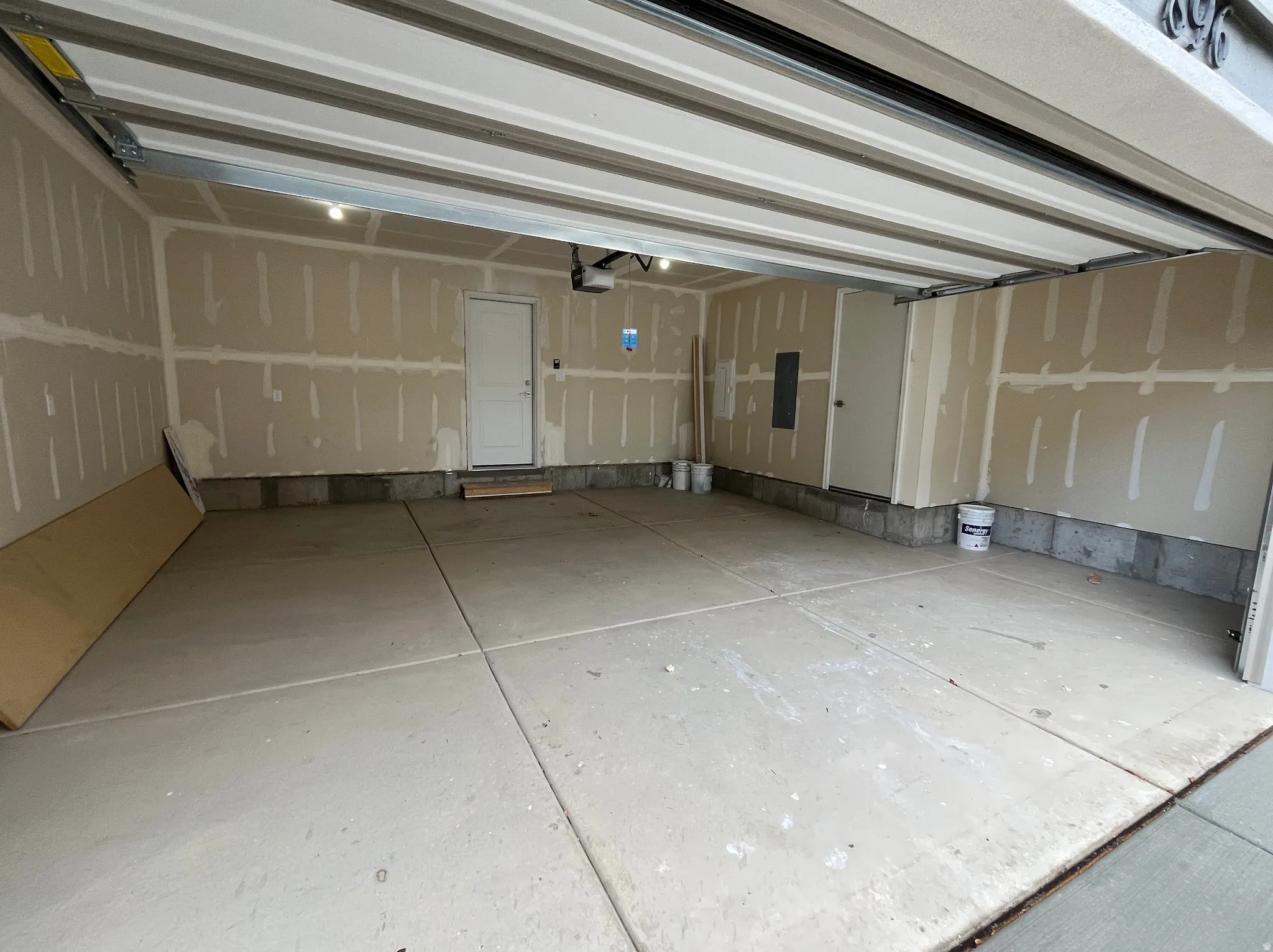 Garage featuring electric panel