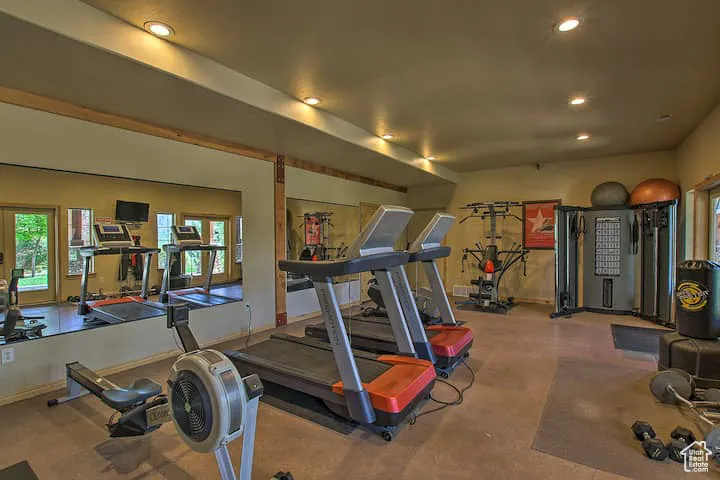 Exercise room featuring recessed lighting