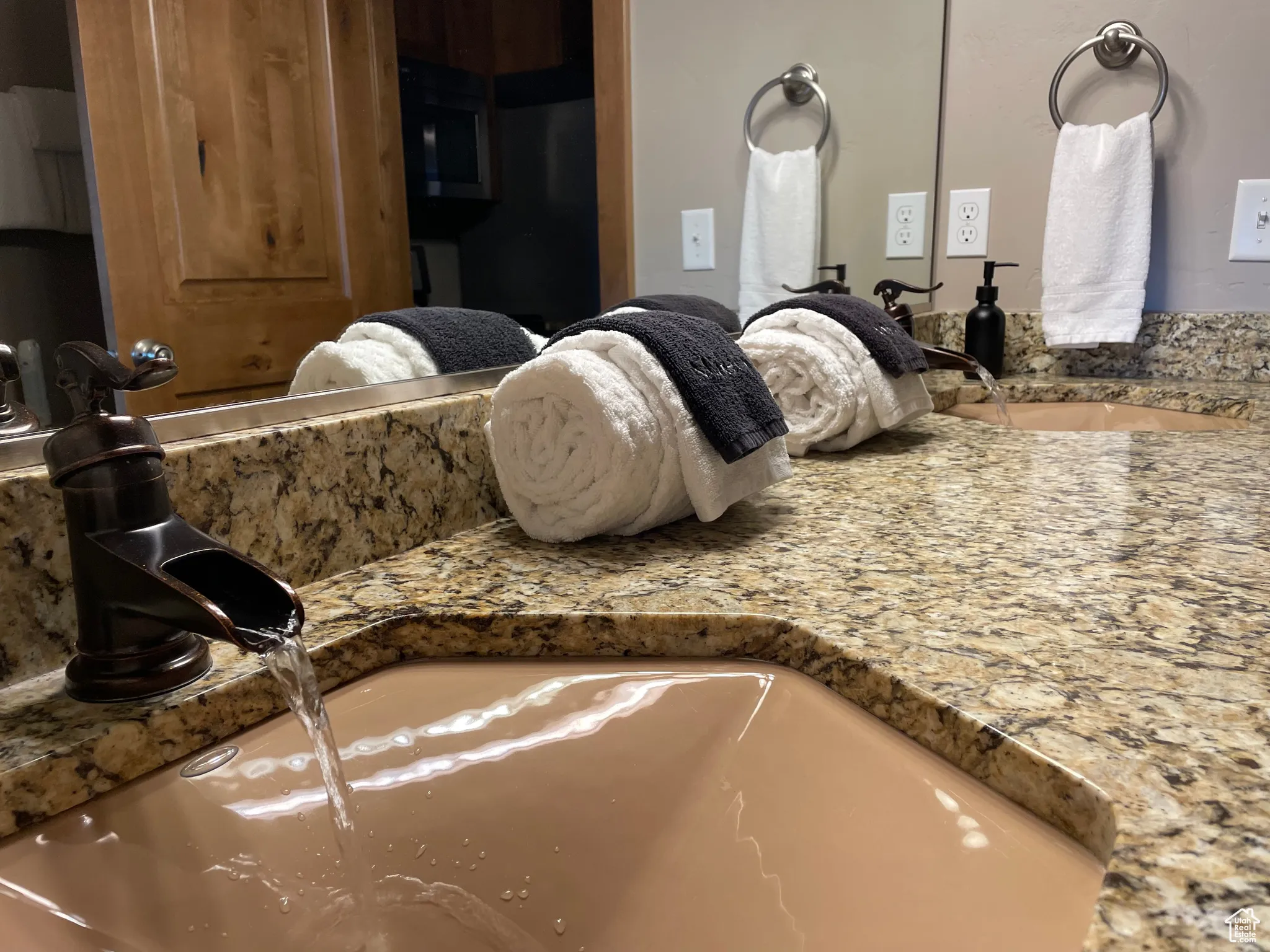 Bathroom view of vanity and built in microwave