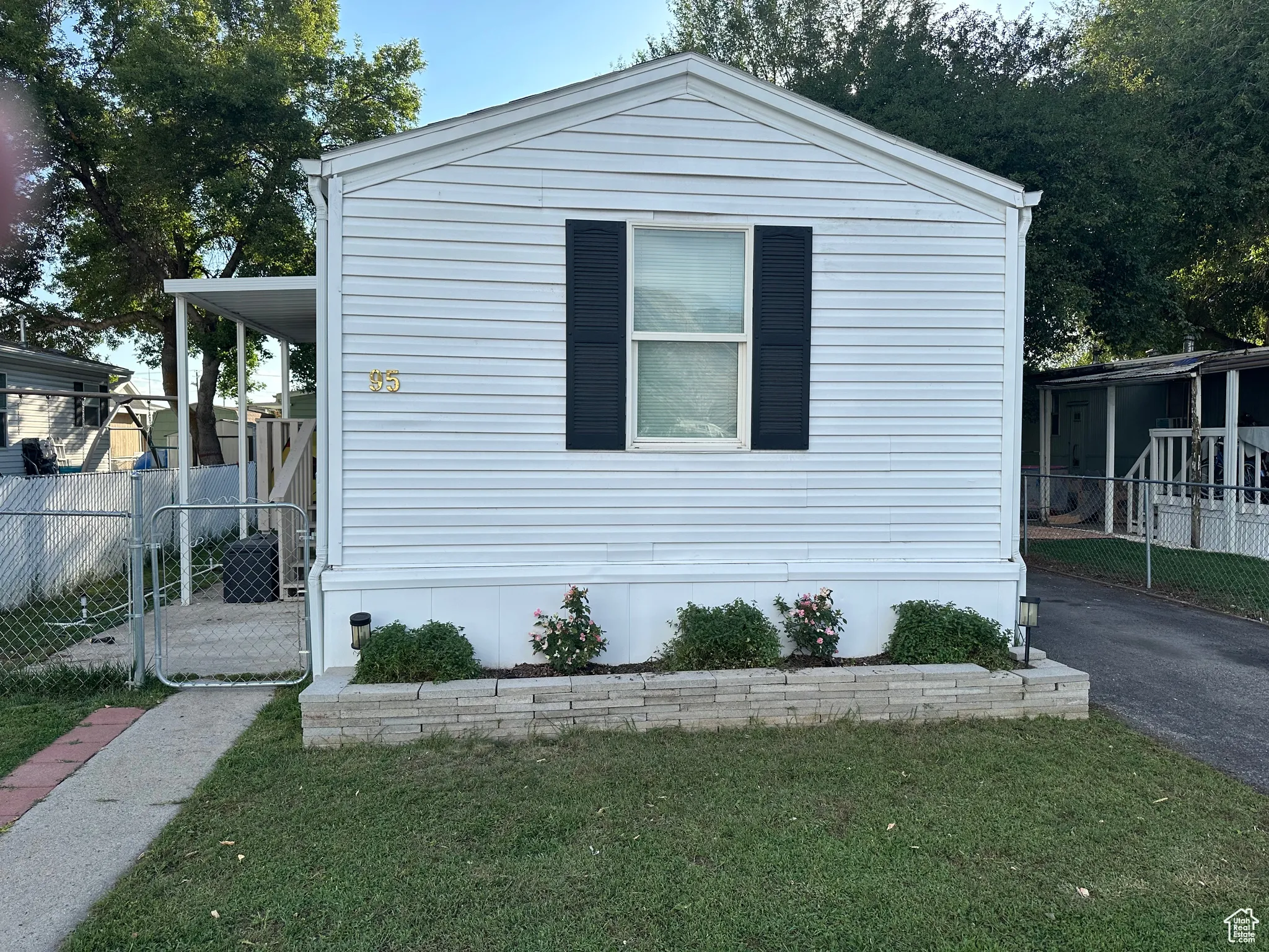 View of front of property featuring a gate