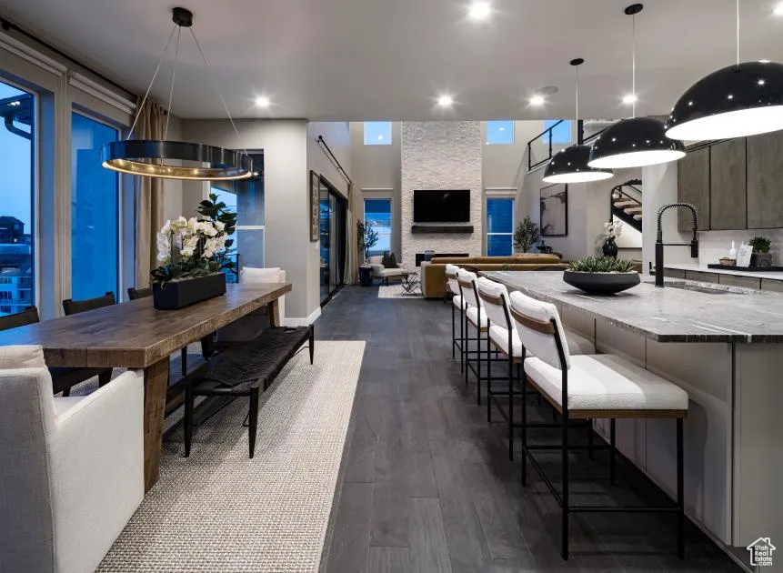 Dining space featuring dark wood-style floors and recessed lighting