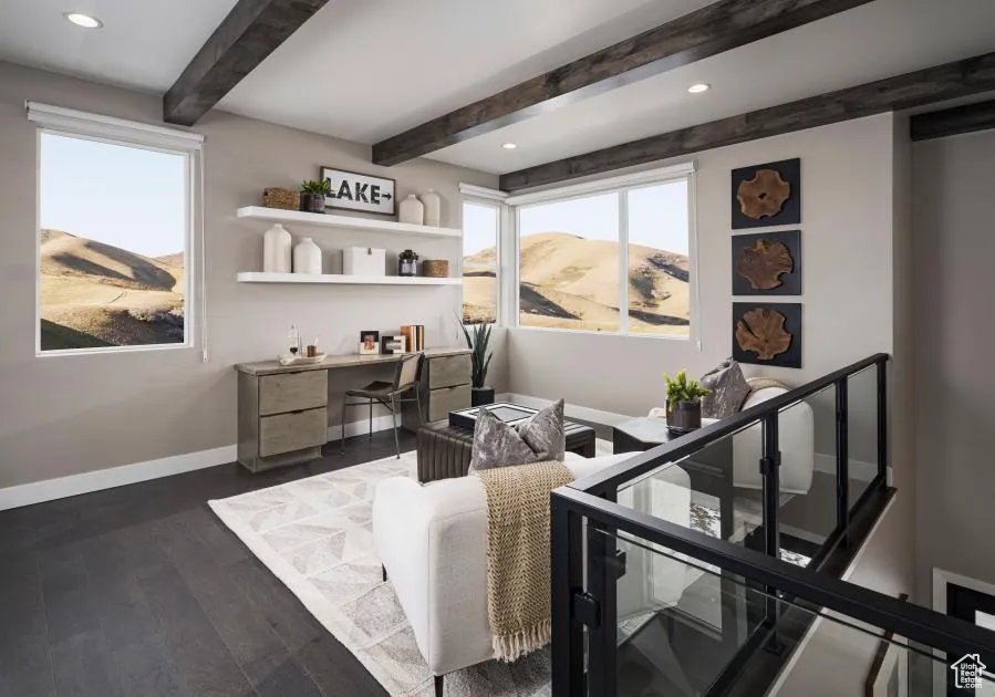 Sitting room featuring a mountain view, dark wood-type flooring, beamed ceiling, recessed lighting, and an upstairs landing