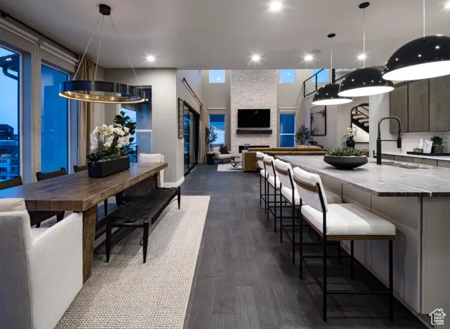 Dining space featuring dark wood-style floors and recessed lighting