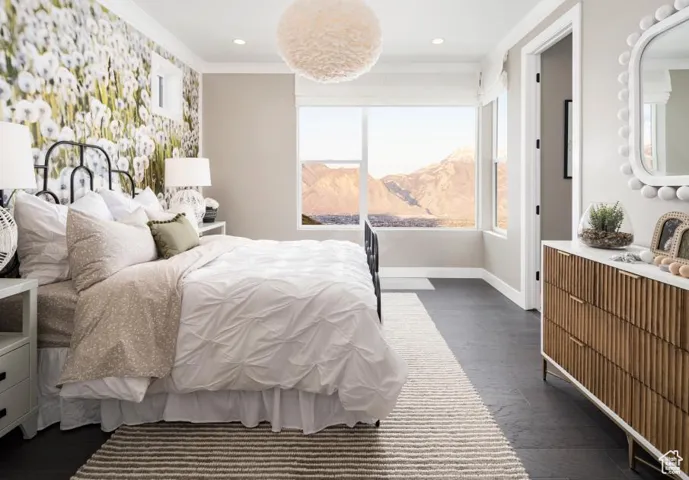 Bedroom with dark wood-style floors, crown molding, a mountain view, and recessed lighting