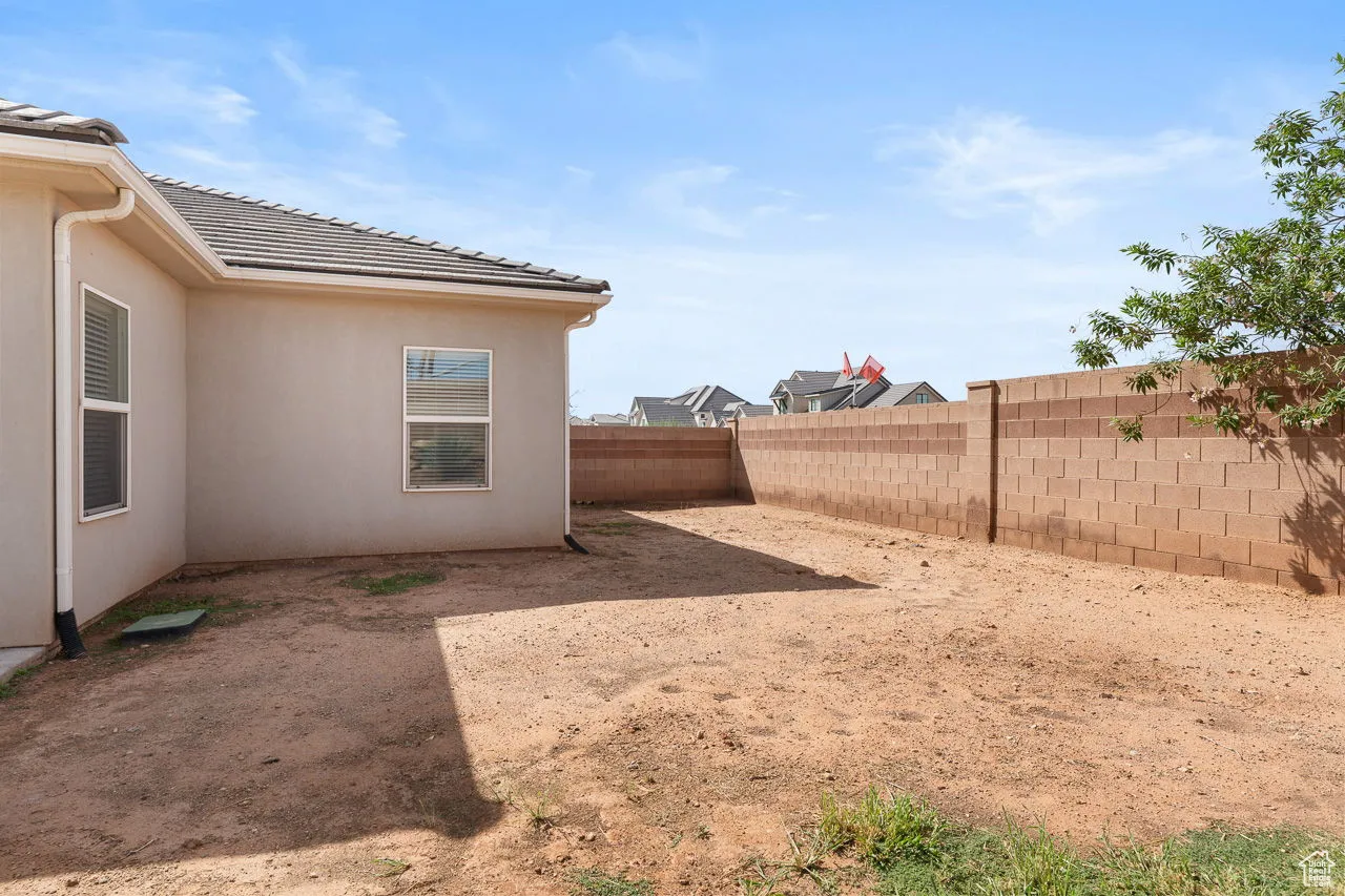 View of fenced backyard