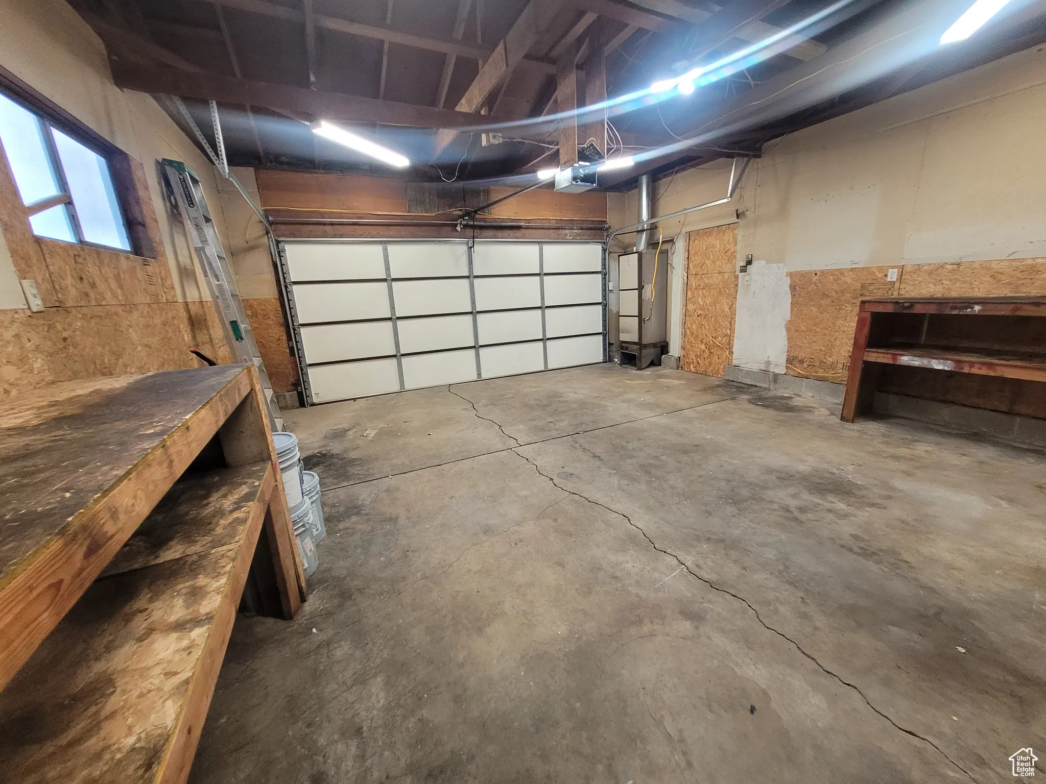 Garage featuring a garage door opener