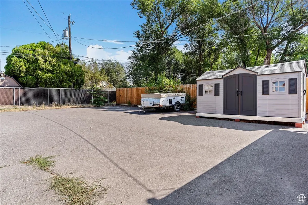 View of patio / terrace featuring a storage shed