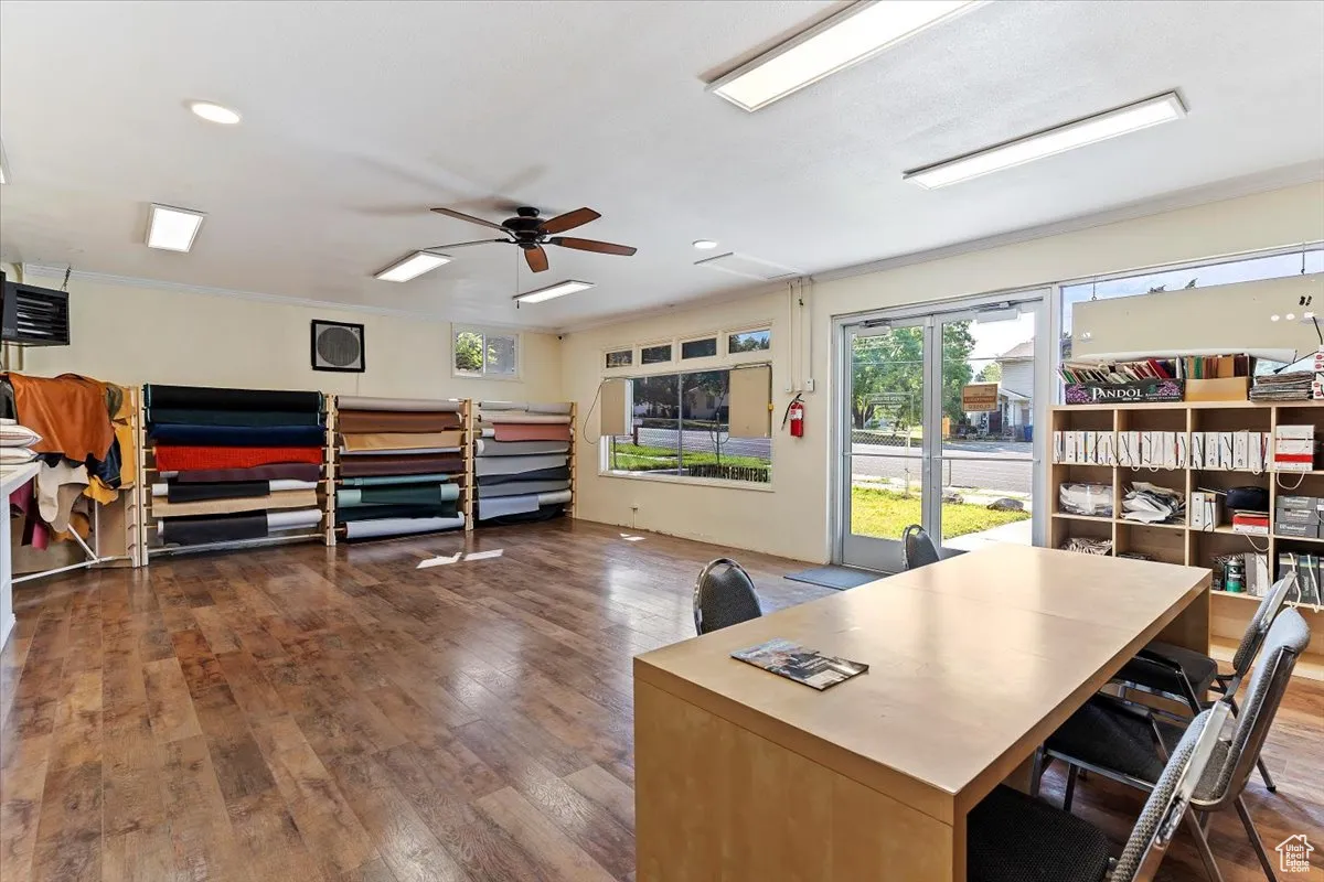 Office featuring dark wood finished floors, ceiling fan, crown molding, recessed lighting, and a heating unit
