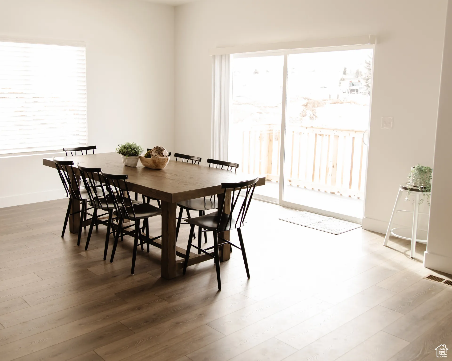 Dining room featuring healthy amount of natural light and light wood finished floors