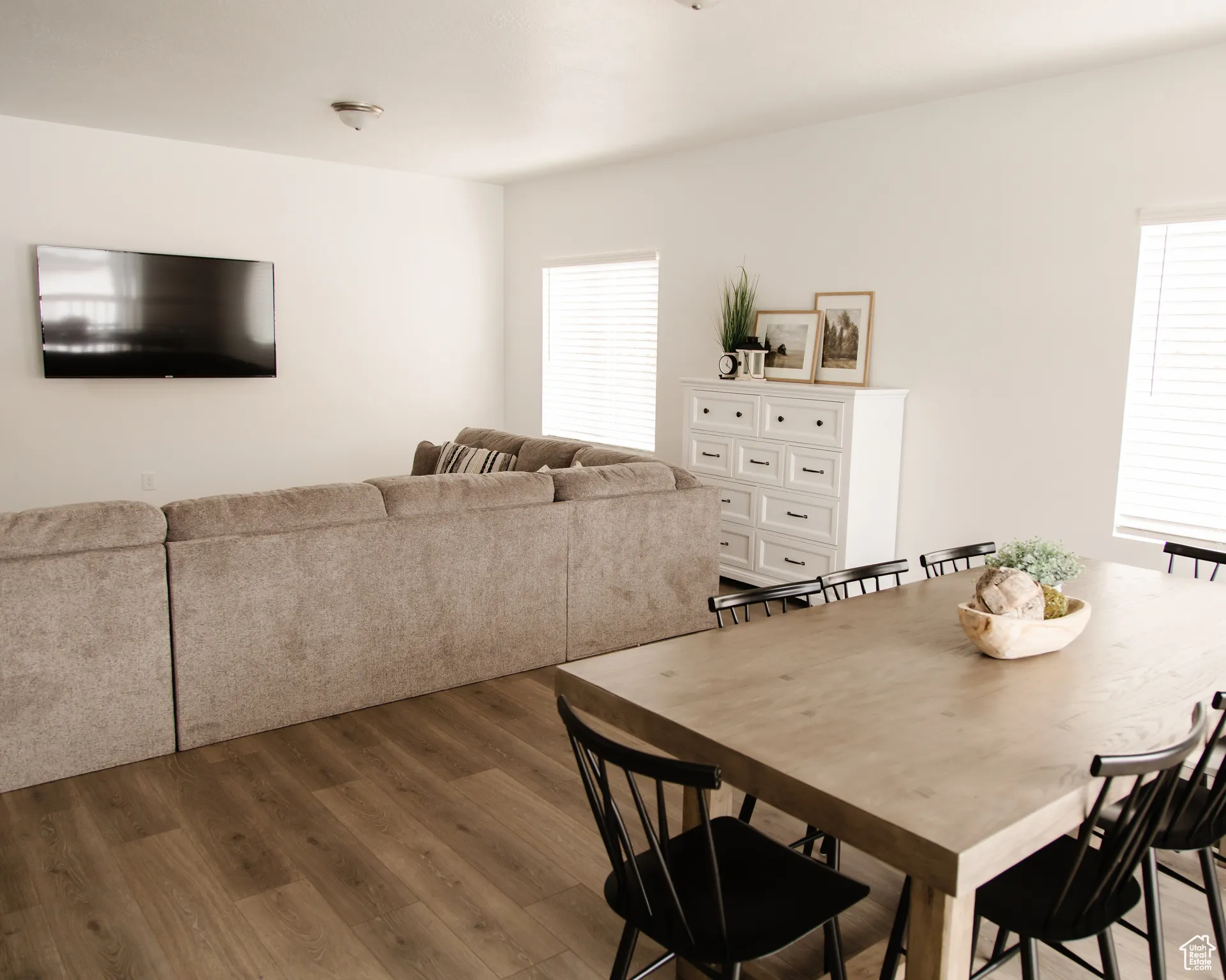 Dining room featuring wood finished floors and healthy amount of natural light