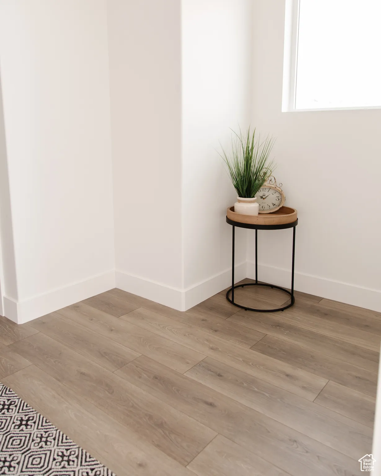 Detailed view of wood finished floors and baseboards