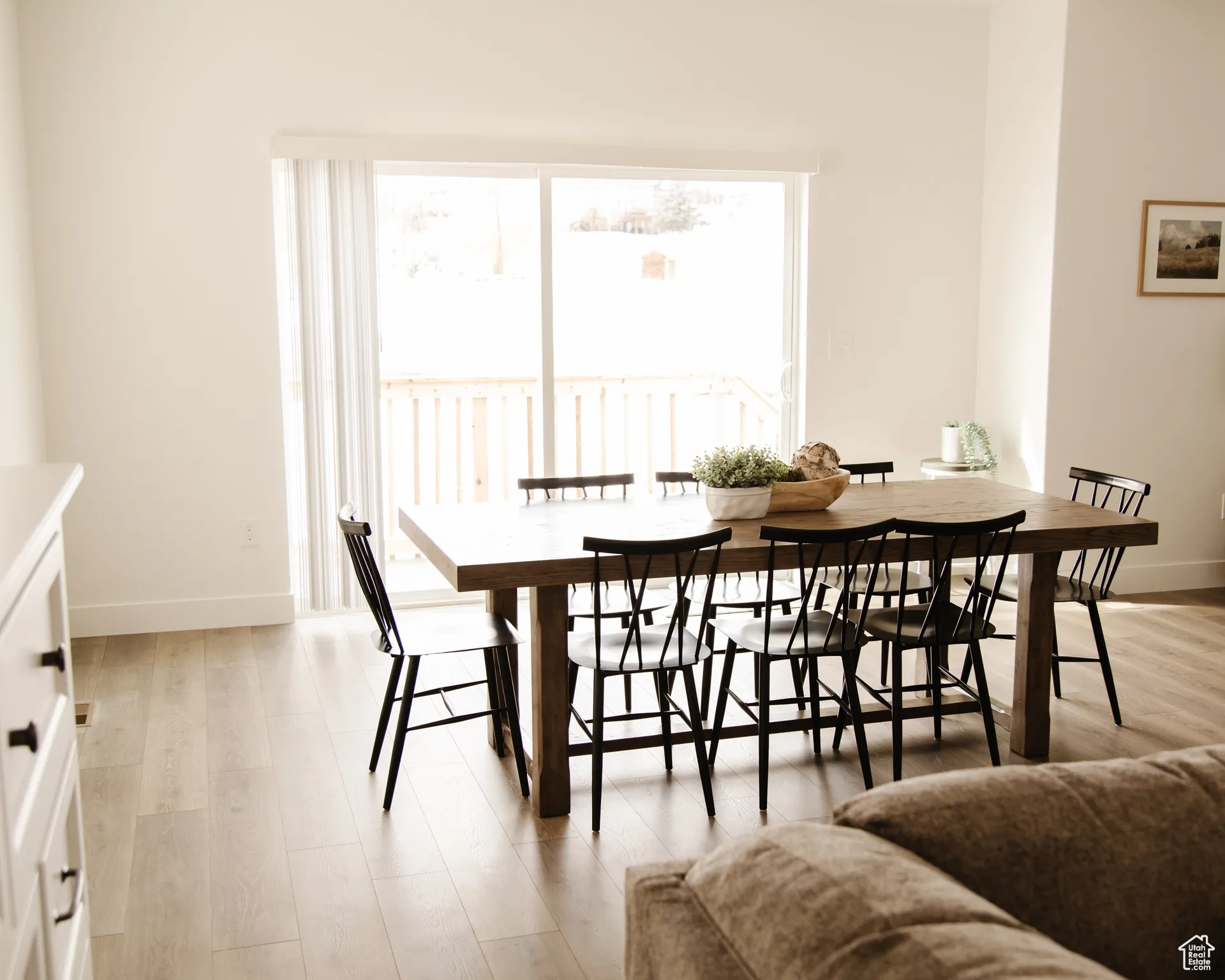 Dining room featuring baseboards and light wood-type flooring
