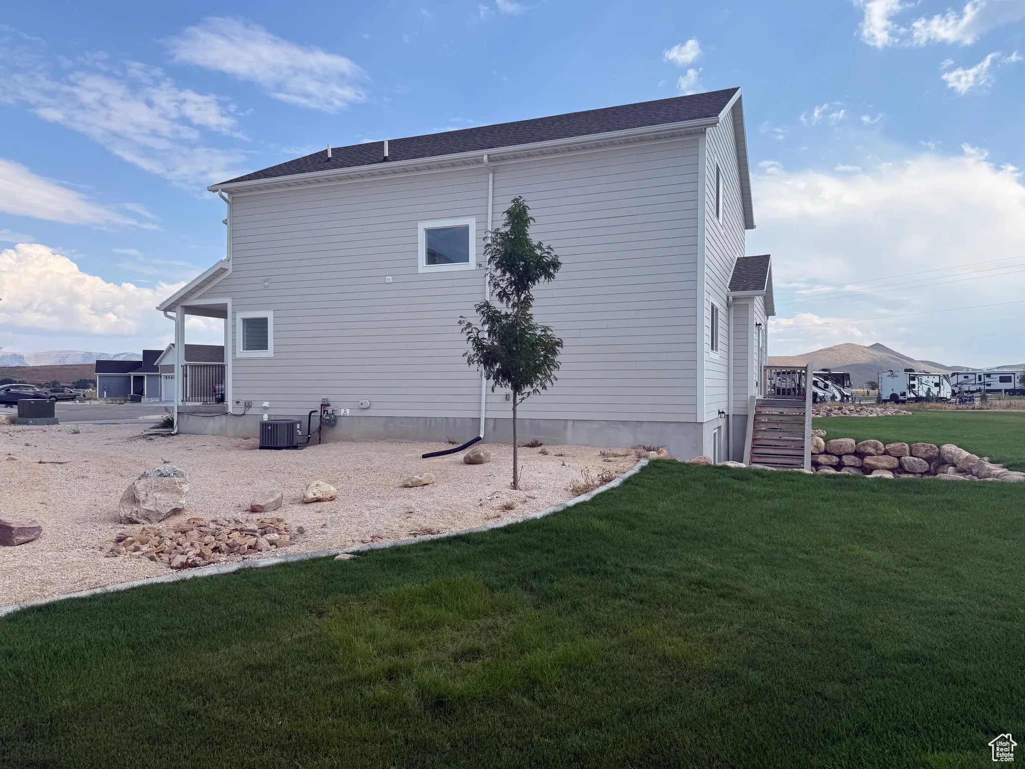 View of home's exterior with a yard