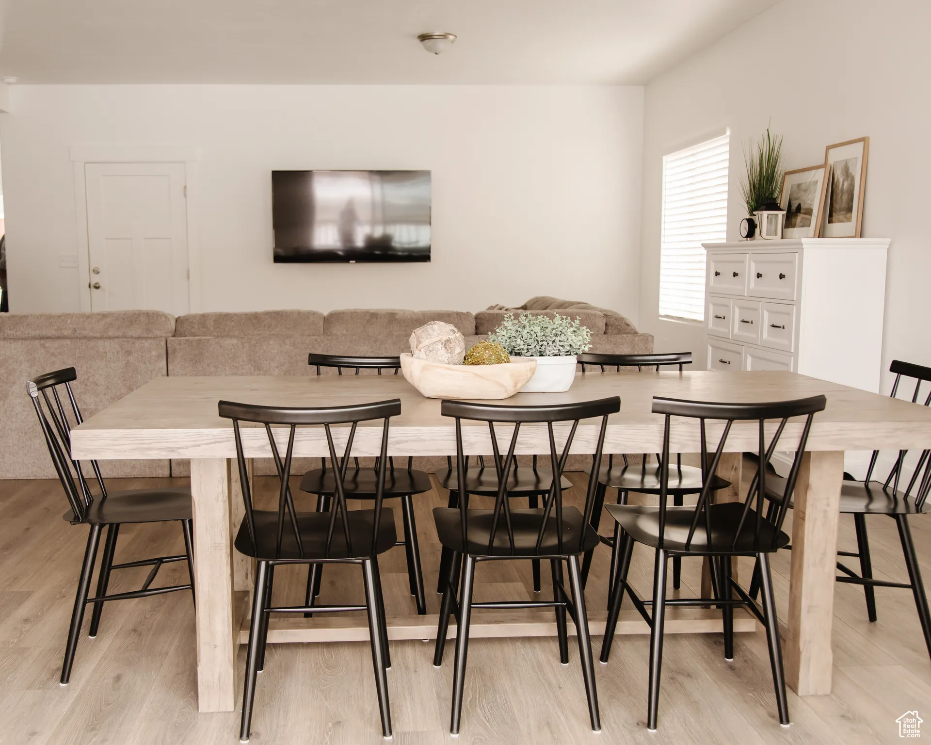 Dining area with light wood finished floors