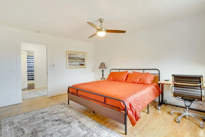 Bedroom featuring light wood-type flooring and a ceiling fan