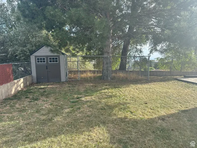 View of yard featuring a storage shed
