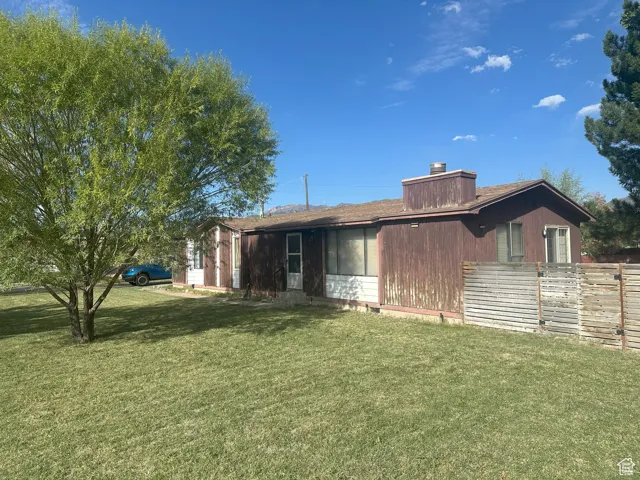 View of front of house with a chimney