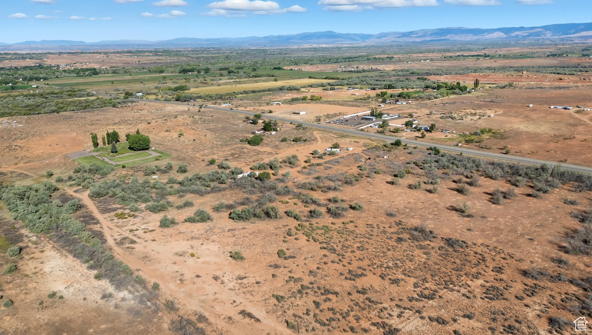 View of property location featuring a mountain backdrop and rural landscape