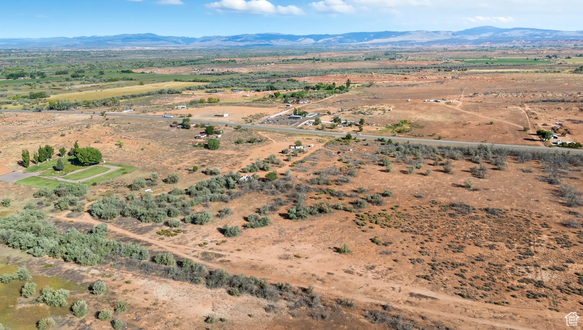 Aerial view of property's location featuring mountains and rural landscape