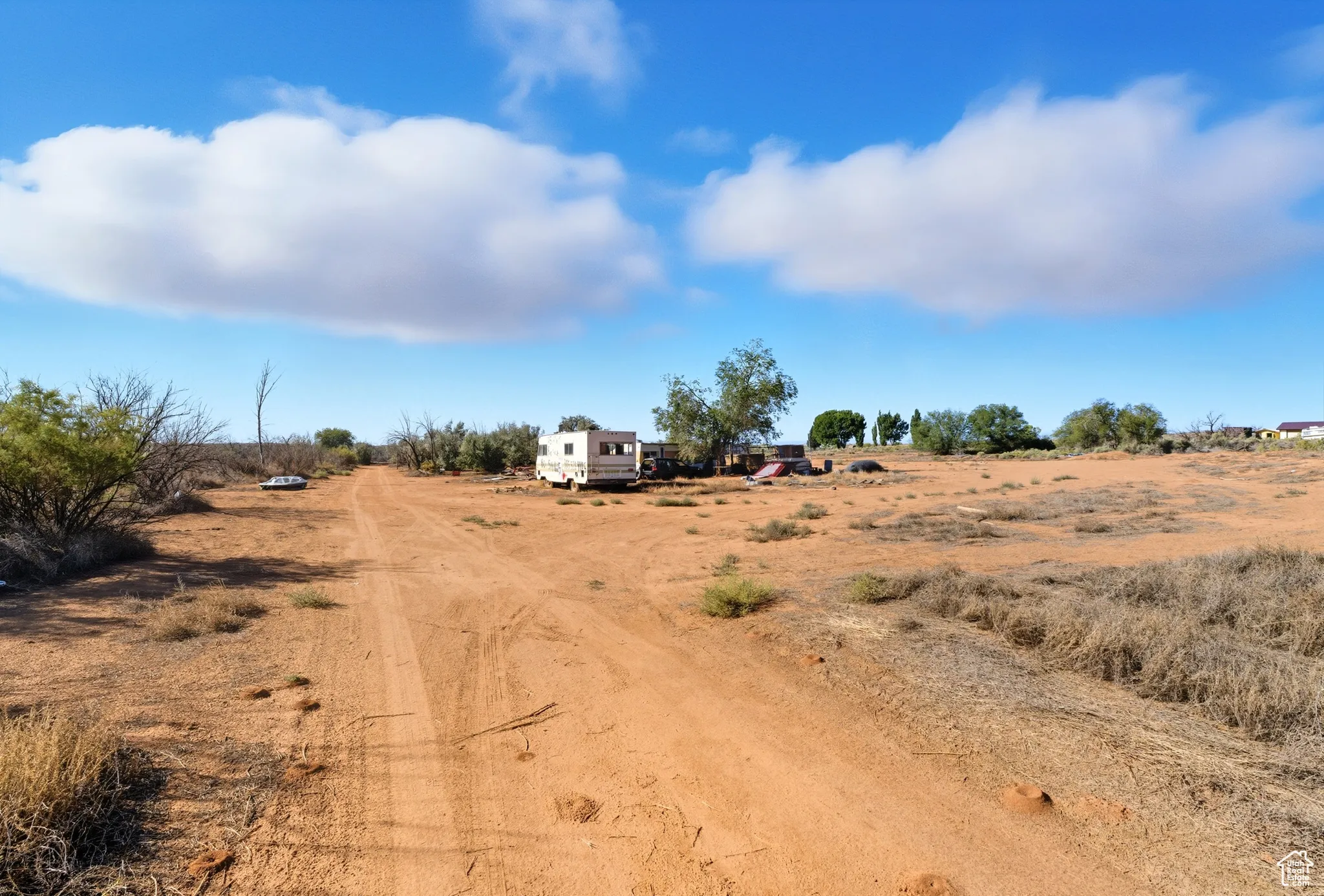 View of dirt / gravel road featuring a view of countryside