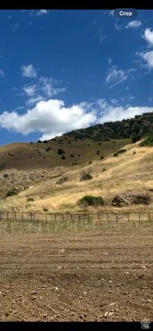 View of mountain backdrop with rural landscape