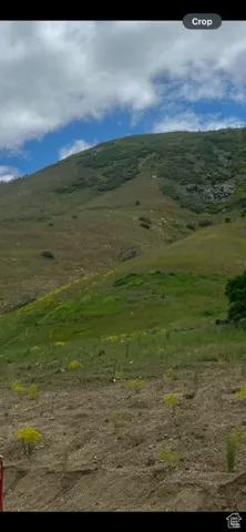 View of mountain backdrop featuring rural landscape