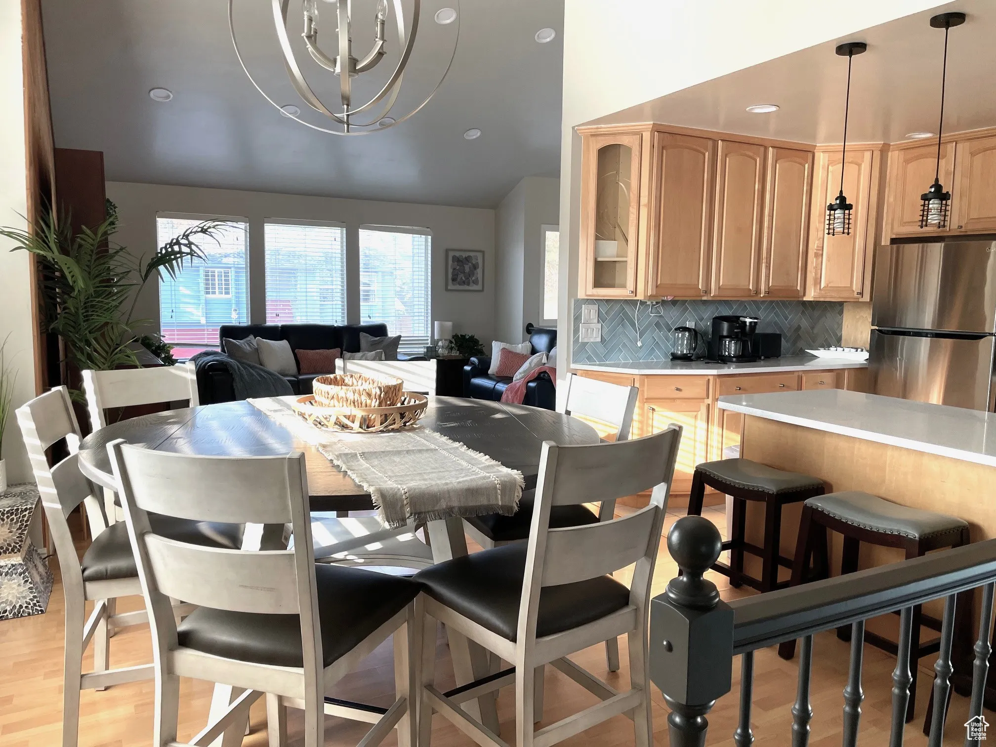 Dining space with recessed lighting, light wood-style flooring, a chandelier, and lofted ceiling
