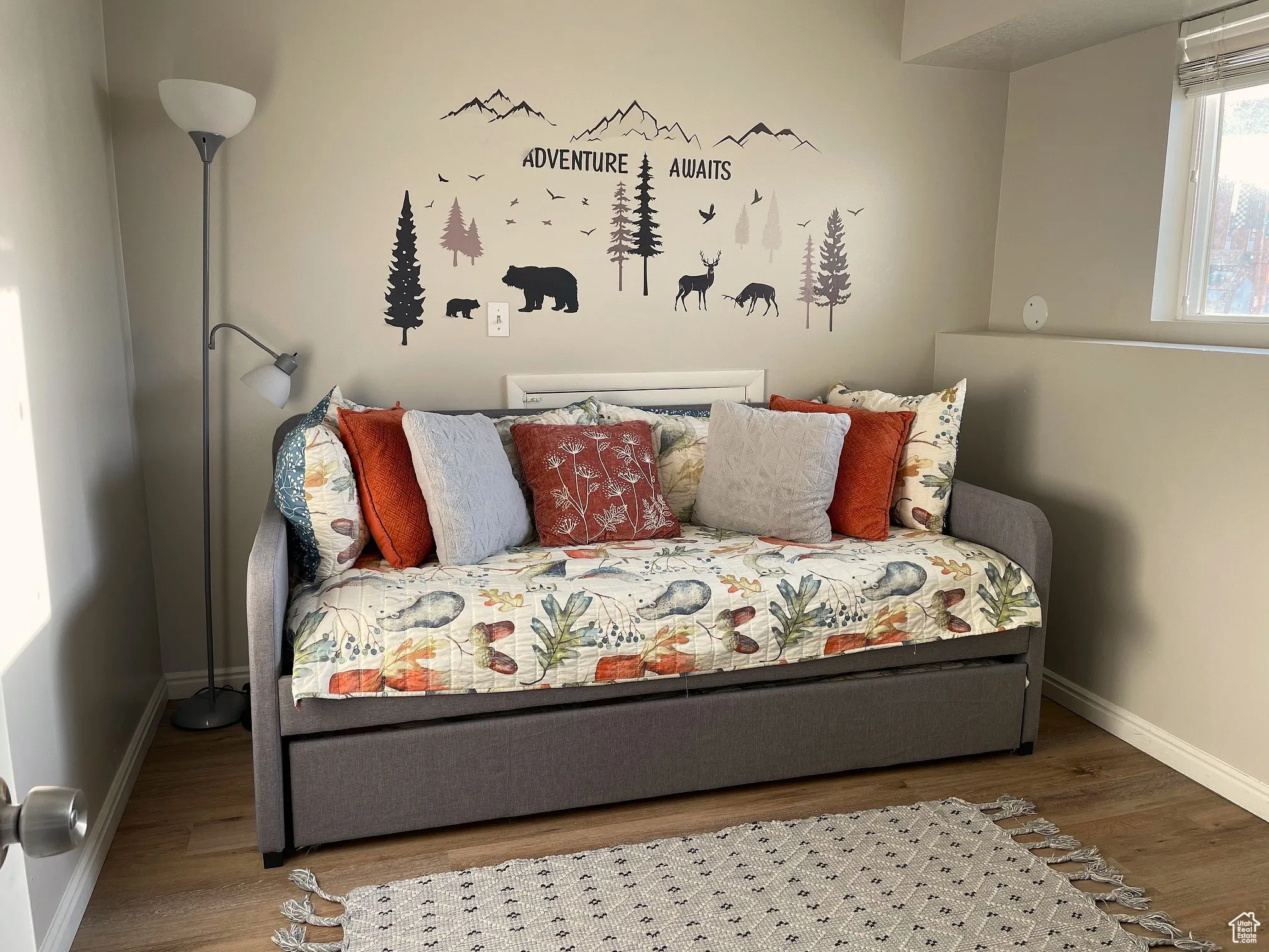 Bedroom with baseboards and wood finished floors