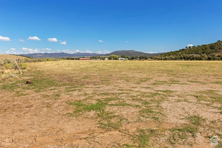 View of mountain background featuring rural landscape